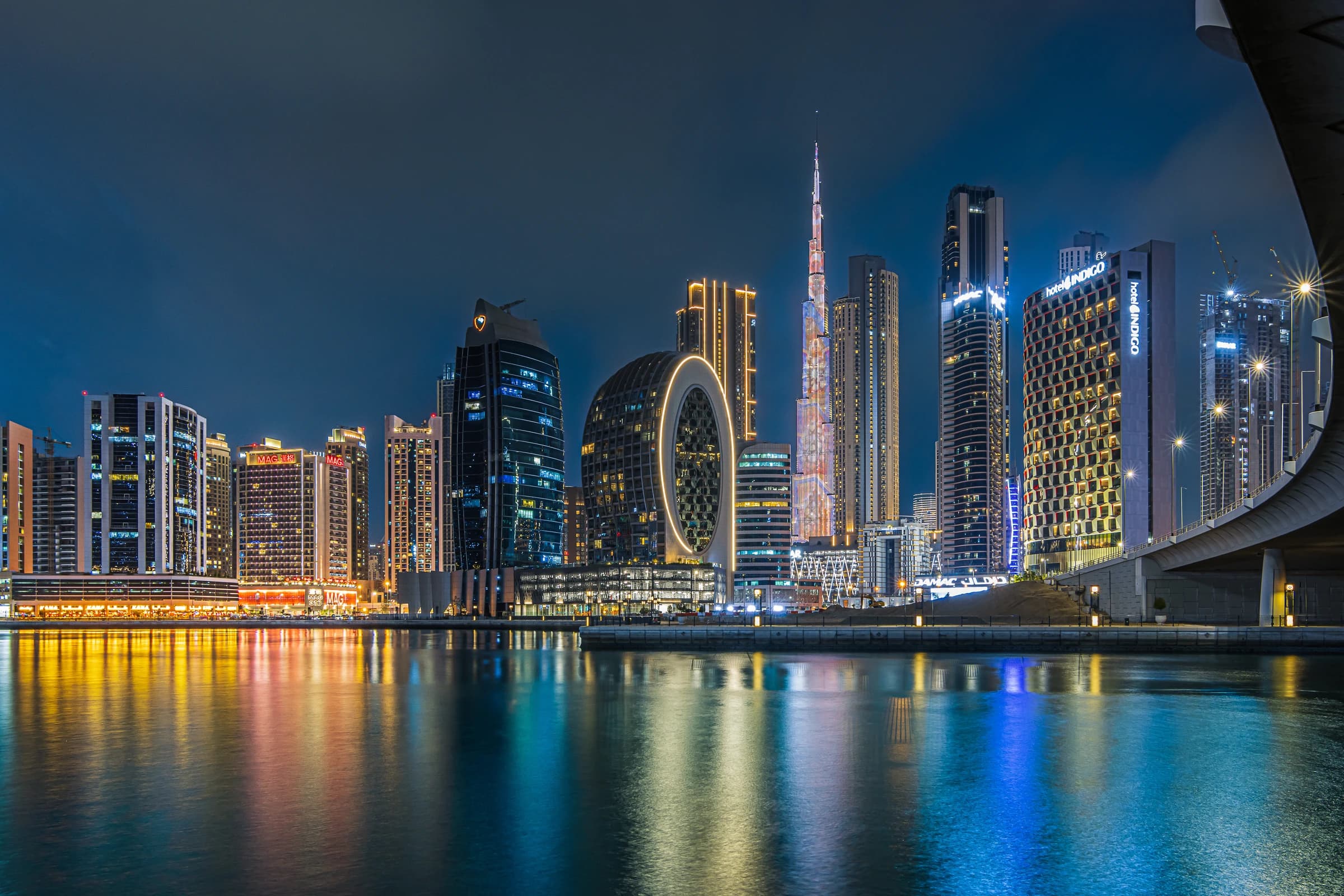 Archive night photograph of Business Bay canal and skyline with Burj Khalifa beyond