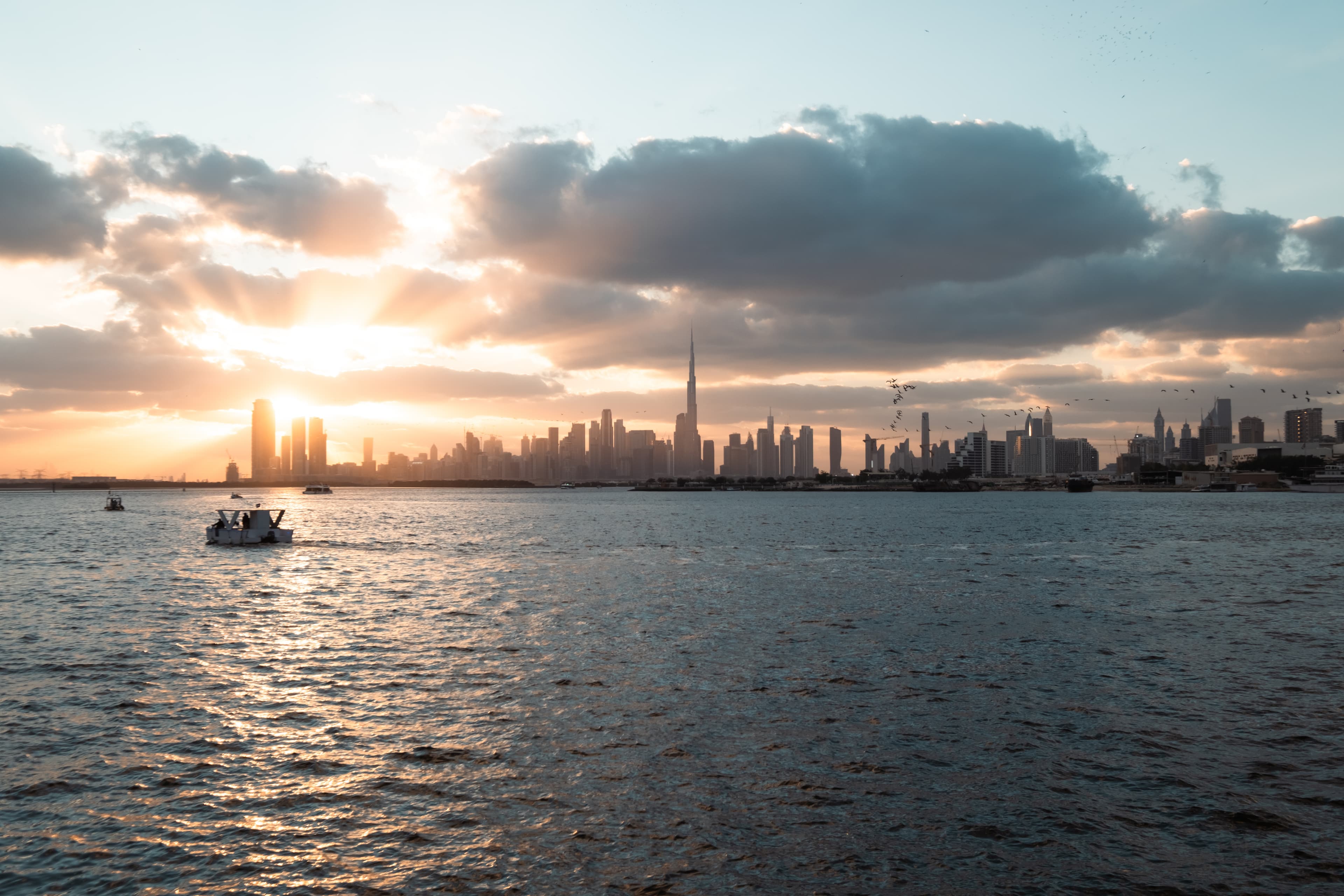 Dubai skyline at sunset, shown as city context