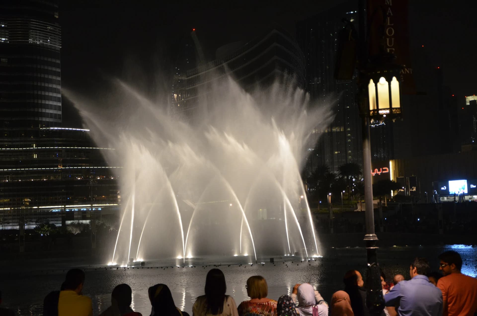 People gathering beside the Dubai Fountain for an evening show
