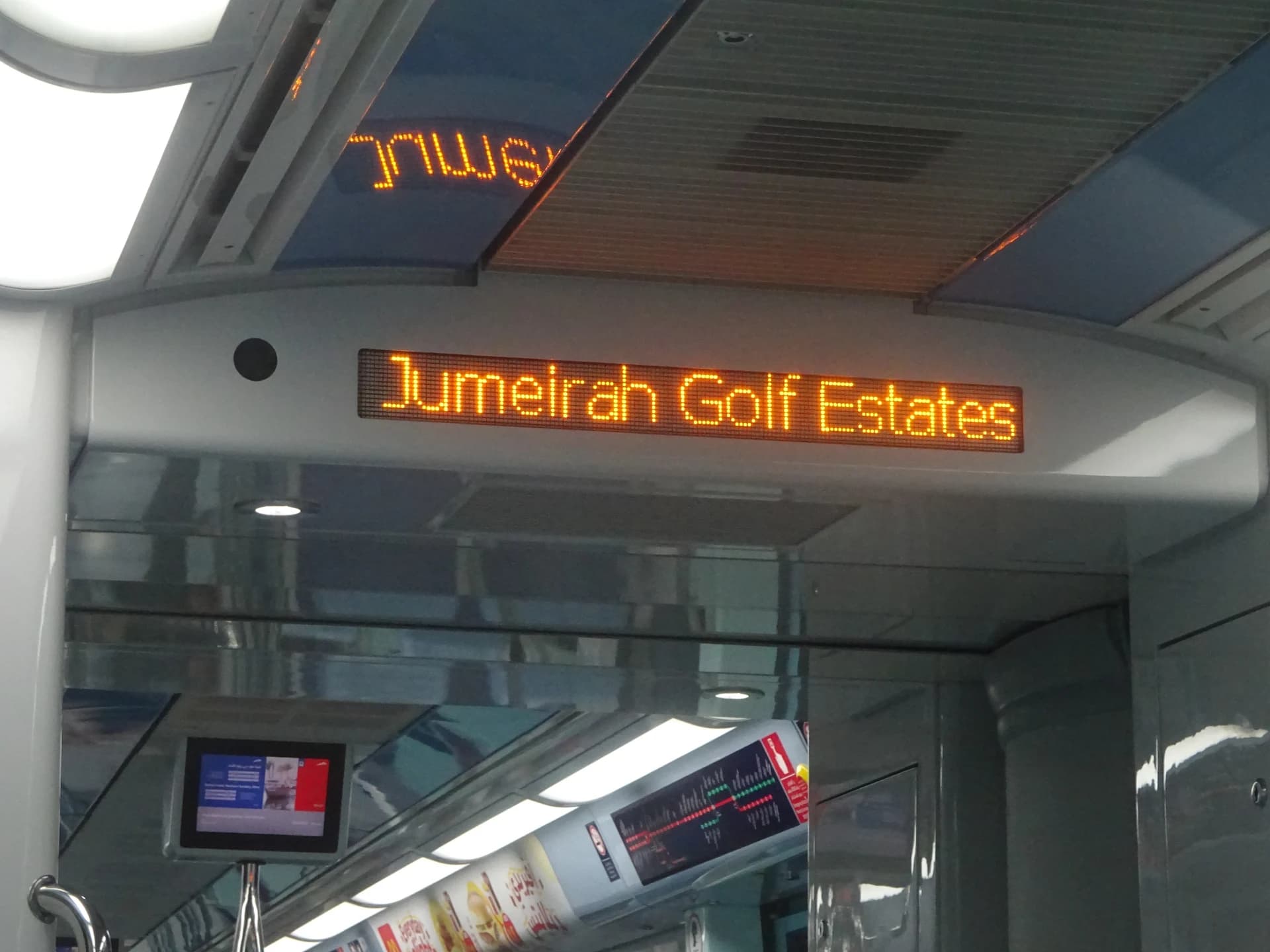 Jumeirah Golf Estates destination sign inside a Dubai Metro train in 2022