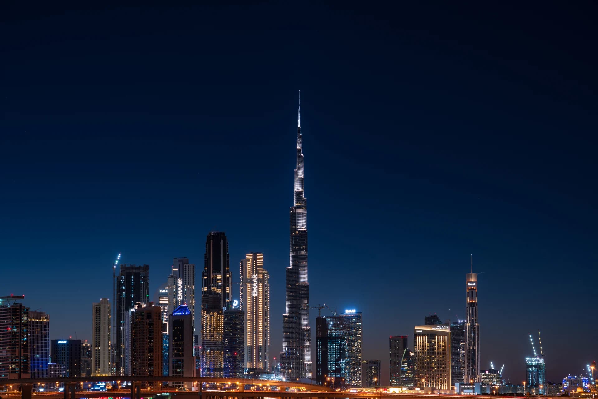 Downtown Dubai towers and Burj Khalifa at night