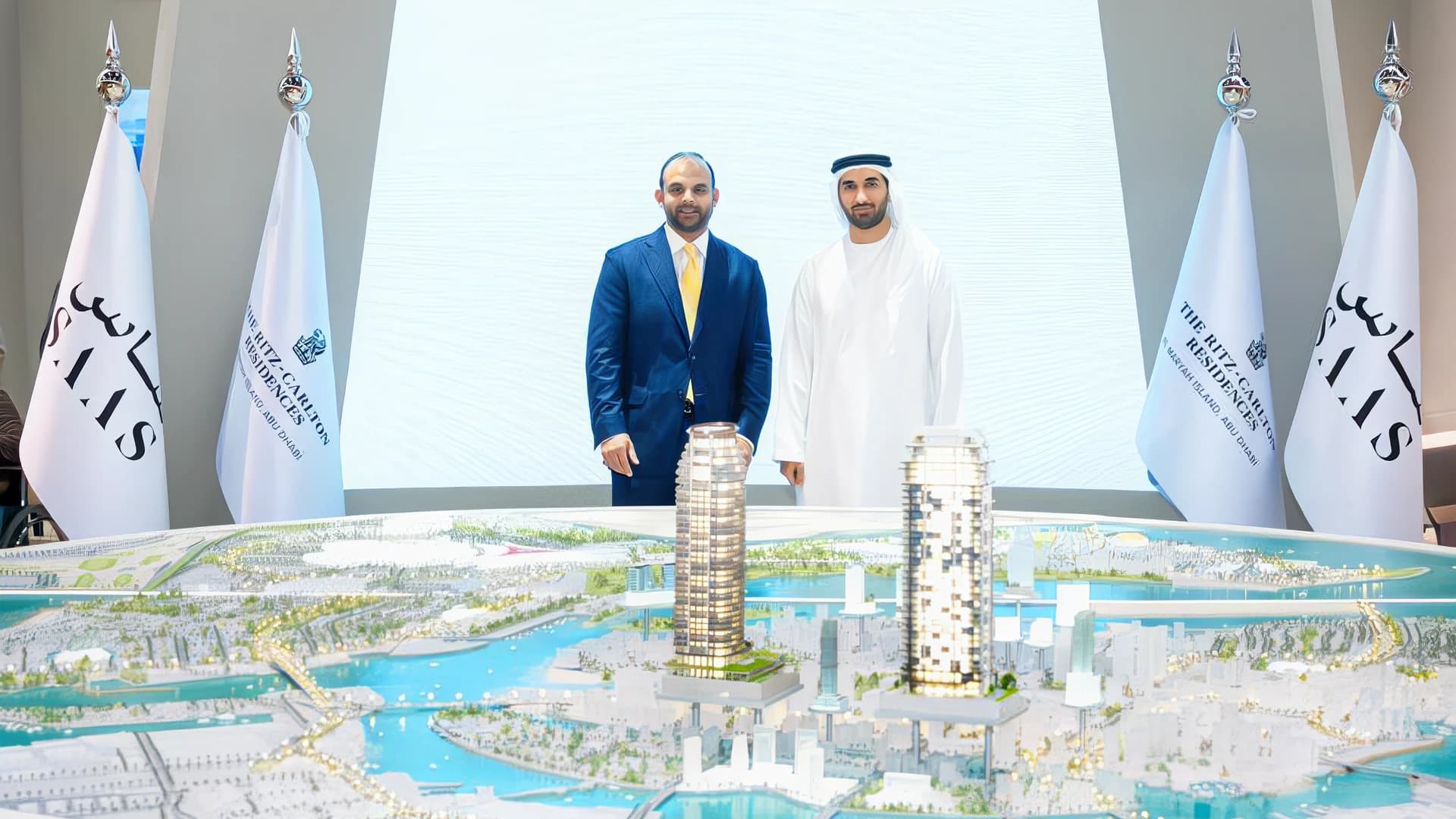 SAAS representatives beside the Al Maryah development model at LIVEX